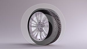 White Alloy Rim Wheel with a Complex Multi Spoke Design with Racing Tyre