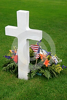 White American cross and flowers