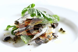White anchovies salad with arugula, potato photo
