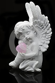 White Angel holding Rose Quartz heart