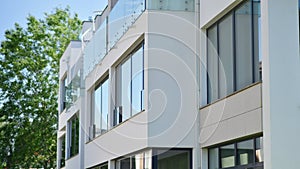 White apartment complex. A small fragment of a modern apartment building.