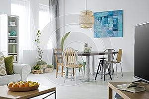 White apartment with green plants