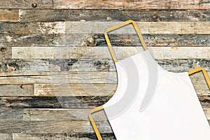 White apron on wooden background