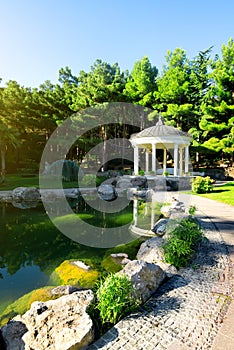 White arbour near lake photo