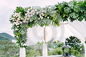 The white arch decorated with flowers, floral for the wedding venue