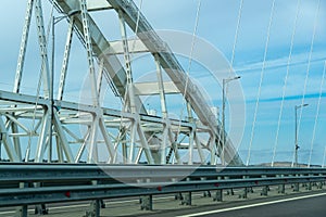 White arches of new Crimean Bridge, also called Kerch Bridge, through Kerch Strait to Crimea. Automobile and railway bridge photo