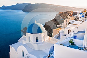 White architecture in Santorini island, Greece. Church with blue dome n Oia town