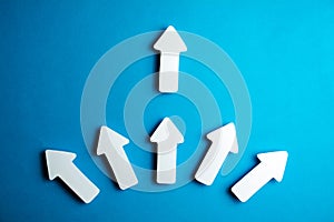 white arrows on a blue background