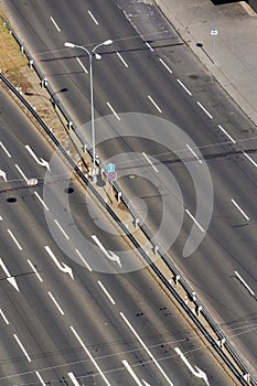 White arrows on driving lanes on empty road, autonomous technology