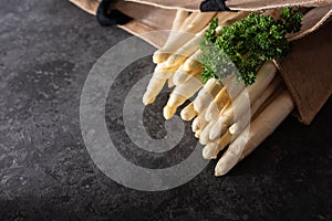 White asparagus on black background photo