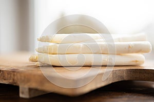 White asparagus on rustic wood