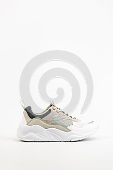 White Athletic Sports Shoes Isolated on White Background. Trainers with Max Air Sole. Women Sport Sneakers Side View.