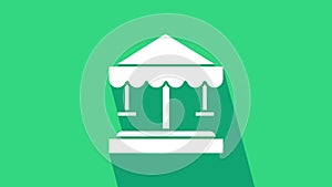 White Attraction carousel icon isolated on green background. Amusement park. Childrens entertainment playground