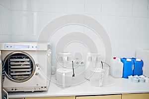 White autoclave in sterilization room in clinic