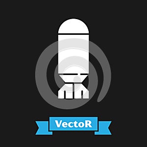 White Aviation bomb icon isolated on black background. Rocket bomb flies down. Vector