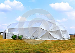 White awning with ventilation equipment at the exhibition camp