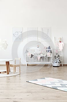 White baby`s bed in room