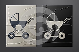 White Baby stroller icon isolated on crumpled paper background. Baby carriage, buggy, pram, stroller, wheel. Paper art