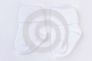 White baby wool socks on white.