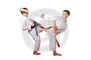 On a white background boys athletes train karate exercises