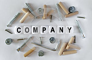 On a white background, building fittings and white cubes with the inscription - Company