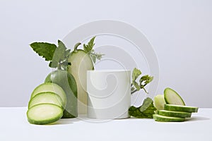 White background featured a cylinder podium white winter melon and green leaves.