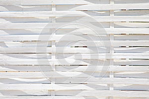 White background with fence of wooden stickers crisscrossed