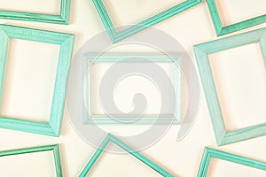 On a white background a lot of turquoise empty frames are laid out. Space for text, layout.