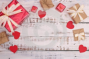 White background made of wood with red heart, gifts Valentine`s Day