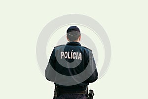On white background a policeman is standing with his back in special clothes with the inscription Police in