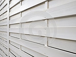 White background texture of horizontal wooden fence boards. Perspective view. Detail of horizontal white boards