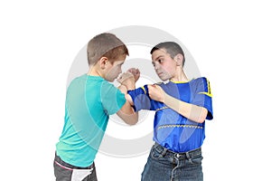 On a white background two boys in sportswear clothing is performing tricks