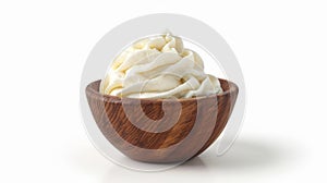 On a white background, whipped yogurt with sour cream in a wooden bowl