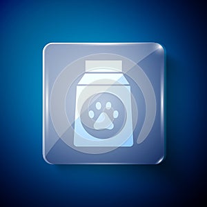 White Bag of food for dog icon isolated on blue background. Dog or cat paw print. Food for animals. Pet food package