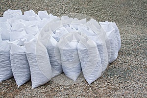 White bags of crushed stones