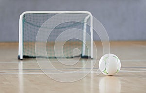 White ball at futsal court. Team sport.