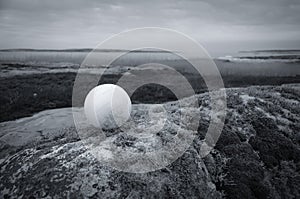White ball in a landscape