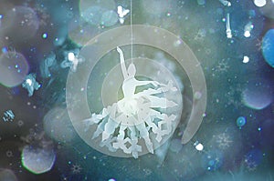 White ballet dancer origami toy for christmas decoration haning on a Christmas tree