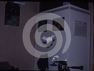 The balloon bursts explosively