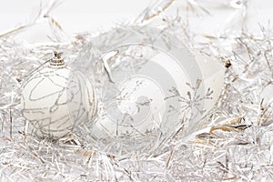 White balls and silver tinsel background photo