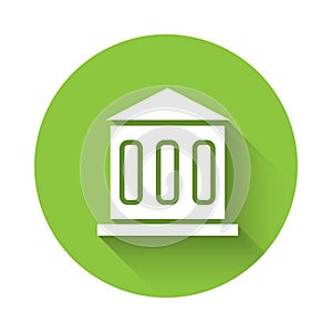 White Bank building icon isolated with long shadow. Green circle button. Vector