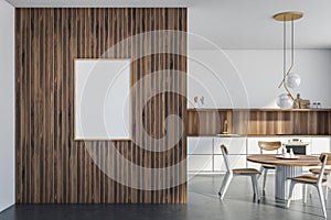 White banner on wooden wall in the dining room area with kitchen