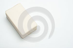 A bar of soap on the white isolated background