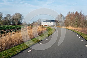 White barn on a curved country road