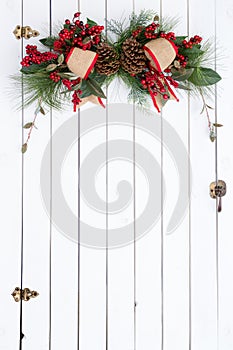 White barn door with rustic Christmas decoration