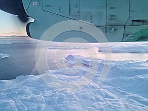White barren arctic circle view in finnmark seen from a propeller aircraft