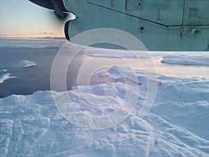 White barren arctic circle view in finnmark seen from a propeller aircraft