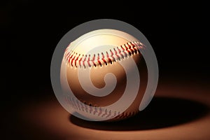 White baseball on dark background