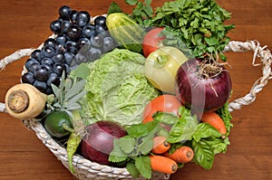 White basket with fresh healthy vegetables and fruit