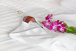 White bathrobe on the bed